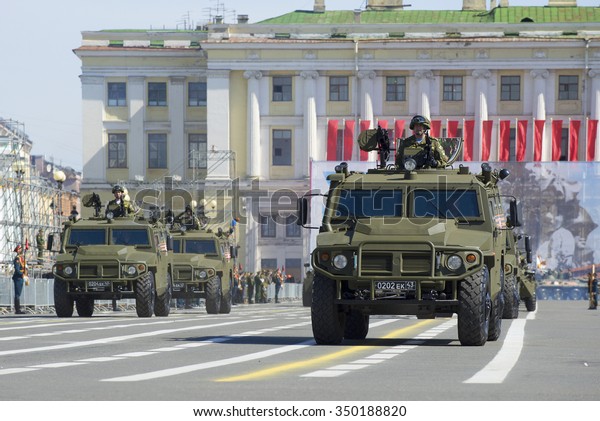 SAINT-PETERSBURG, RUSSIA - MAY 05, 2015: A convoy of\
military armoured multipurpose cars \