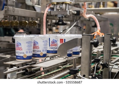 Saint-Petersburg, Russia - November 16, 2016: The Test Pack Of Dairy Products On The Assembly Line In The Workshop Of The Machine-building Plant For The Production Of Packaging Machines.