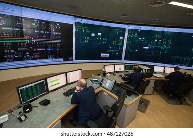 Saint-Petersburg, Russia - September 22, 2016: Top View Of The Office Managing The Power Company. Energy Engineers Work At Computers Monitor The City Grid.