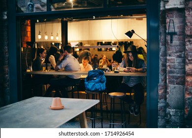 Saint-Petersburg, Russia- Summer 2018 .

A Restaurant/bar With Open Windows And Terrace Crowded At Friday Evening . 