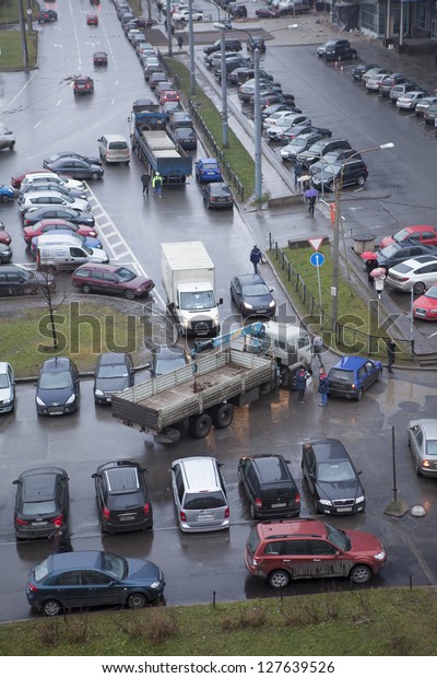 SAINT-PETERSBURG,\
RUSSIA-NOVEMBER 26: Car accident in city street. There is no area\
to maneuver for truck due wrong parking cars on November 26, 2012\
in Saint-Petersburg,\
Russia.