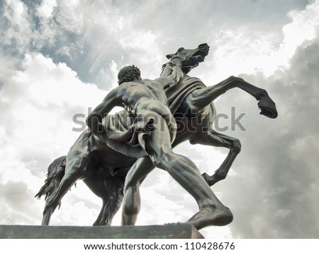 Saint-Petersburg sculpture: The Horse Tamers, designed by the Russian sculptor, Baron Peter Klodt von Urgensburg. Anichkov bridge, Saint-Petersburg, Russia