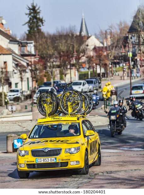 SAINT-PIERRE-LES-NEMOURS,FRANCE,MARCH\
4: Row of technical teams cars during the first stage of the famous\
road bicycle race Paris-Nice, on March 4, 2013 in\
Saint-Pierre-les-Nemours