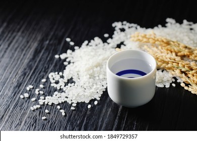 Sake, Rice And Rice Plant On Dark Background