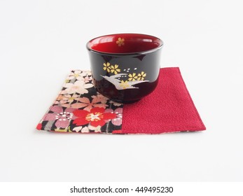 sake(rice wine) cup, beautiful color of lacquered  on white background - Shutterstock ID 449495230