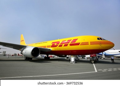 SAKHIR AIRBASE, BAHRAIN - JANUARY 21: Static display of DHL Cargo plane with vehicle kept inside in Bahrain International Airshow at Sakhir Airbase, Bahrain on 21 January, 2016