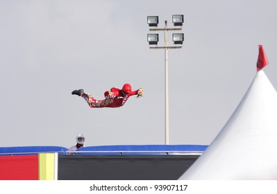 SAKHIR AIRBASE, BAHRAIN - JANUARY 21: A Person Showing Acrobatic On Aerodium, A Vertical Wind Tunnel At The Venue  Of Bahrain International Airshow At Sakhir Airbase, Bahrain On 21 January, 2012