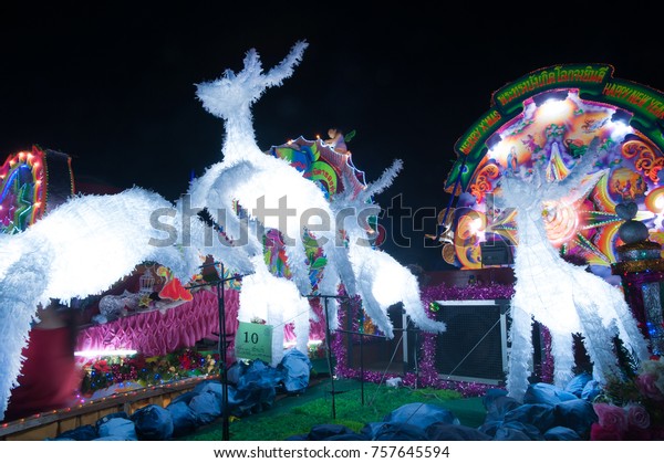 SAKON NAKHON, THAILAND - DEC 25 ,2015 :The\
celebrating Christmas with the dazzling star parade on more than\
200 cars together with a Santa Claus and angels parade in parade of\
Christmas Star Festival.