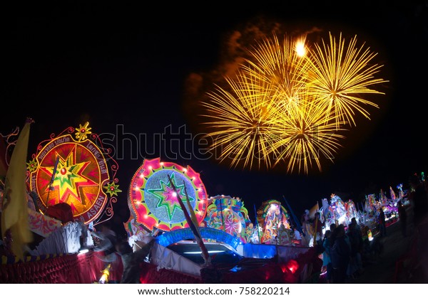 SAKON NAKHON, THAILAND - DEC 25, 2015 :The\
celebrating Christmas with the dazzling star parade on more than\
200 cars together with a Santa Claus and angels parade in Parade of\
Christmas Star Festival.