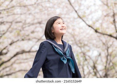 Sakura in full bloom and a junior high school girl newly enrolled - Shutterstock ID 2165152649