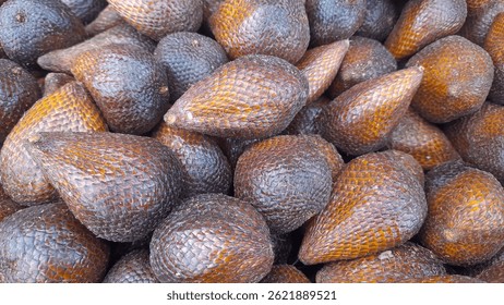Salacca zalacca or Salak fruit. Pile of snakefruit or zalacca or salak in the market.