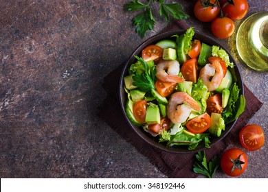 Salad With Avocado And Shrimps In Bowl, Top View, Copy Space