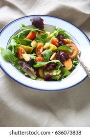 Salad With Baby Heirloom Tomatoes And Croutons On A Beige Napkin With Copy Space