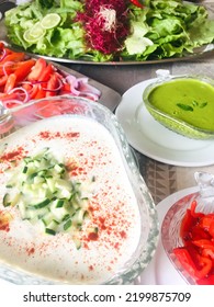 Salad Bar With With Colorful Healthy Dips. Lettuce, Yogurt Sauce And Green Goddess Dressing.