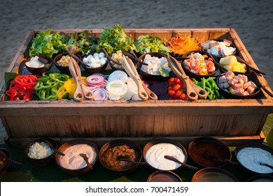 Salad Bar With Fresh Vegetables On Ice.