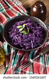 Salad Of Boiled Red Cabbage In A Dark Bowl.