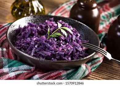 Salad Of Boiled Red Cabbage In A Dark Bowl.