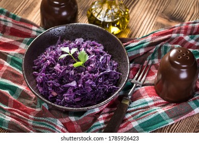 Salad Of Boiled Red Cabbage In A Dark Bowl.