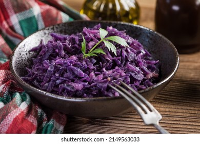 Salad Of Boiled Red Cabbage In A Dark Bowl.