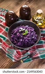 Salad Of Boiled Red Cabbage In A Dark Bowl.