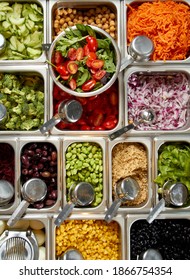 Salad Buffet With Fresh Vegetables From Overhead. Top View Of Bins With Colorful Food