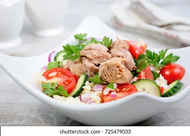   Salad from canned tuna with tomatoes, cucumber and orzo