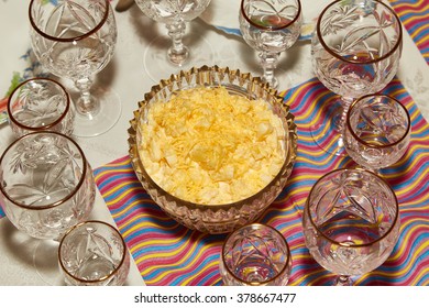Salad from cheese and pineapples costs on a table among beautiful shot glasses
