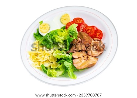salad chicken liver, pasta salad , tomato, green leaf lettuce, boiled egg, farfalle snack meal food on the table copy space food background rustic top view
