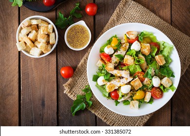 Salad with chicken, mozzarella and cherry tomatoes. Top view