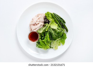 salad with chicken on the whtie