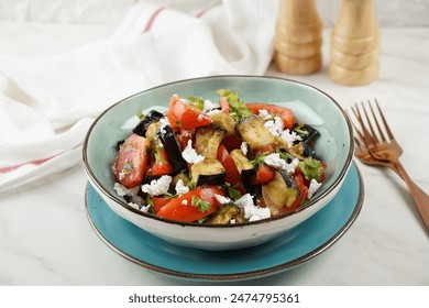Salad of crispy fried eggplant and tomatoes, with Feta cheese,  Parsley - Powered by Shutterstock