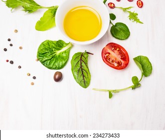 Salad  with dressing,olives and tomatoes on white wooden background, top view - Powered by Shutterstock