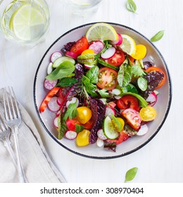 Salad with fresh summer vegetables, top view, square image - Shutterstock ID 308970404