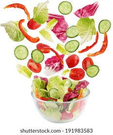 Salad Of Fresh Vegetables Falling Into A Bowl