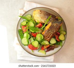 Salad And Fried Fish Pieces