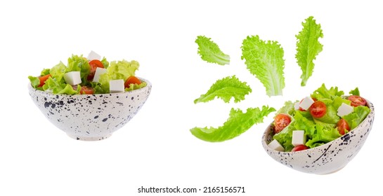 Salad With Green Lettuce, Cherry Tomatoes And Curd Cheese Cubes In A Round Plate Isolated On White Background. The Concept Of Healthy Nutrition, Proper Nutrition. Levitating Lettuce Leaves