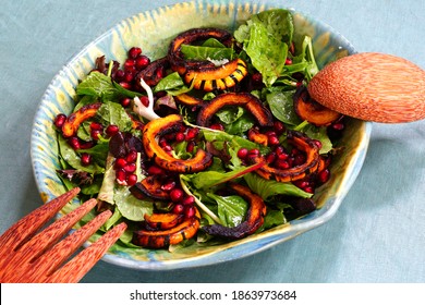 Salad Greens With Roasted Delicata Squash And Pomegranate Seeds