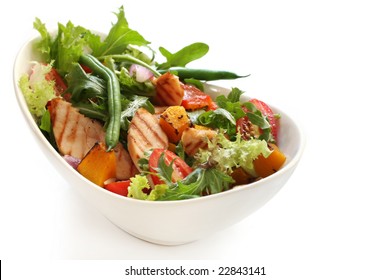 Salad with grilled chicken breast, mixed greens, roasted vegetables, tomatoes, beans, capsicum, onion, pumpkin.  Delicious healthy eating. - Powered by Shutterstock