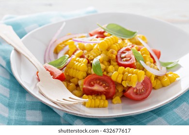 Salad With Grilled Corn, Tomatoes And Red Onion