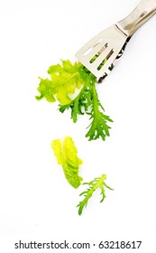Salad leaves and tongs isolated on white background