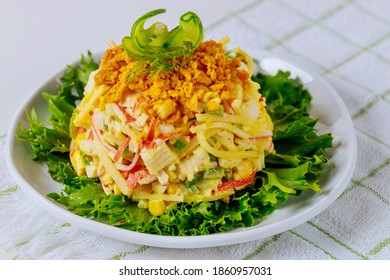 Salad Made From Crab Meat, Eggs And Corn In A White Plate. Seafood Dish.