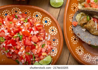 Salad Pico De Gallo And Tacos On A Wooden Table. Typical Mexican Food.