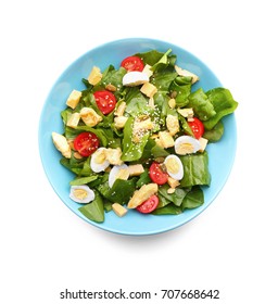 Salad With Quail Eggs And Spinach In Plate Isolated On White