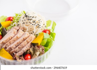 Salad with roasted pork and soba noodles by clean food concept in lunch box - Shutterstock ID 296407619