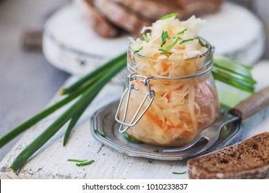 Salad Sauerkraut In A Glass Jar On A Table