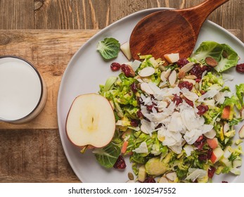 Salad With Shaved Brussel Sprouts, Apple, Parmesan Cheese And Almonds.