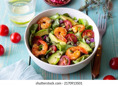 Salad with shrimps, avocado, tomatoes, onions and seeds Healthy eating - Powered by Shutterstock