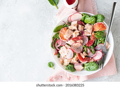 Salad With Spinach, Grilled Salmon, Radish And Sicilian Red Oranges. Concept For A Tasty And Healthy Food. Top View. Selective Focus.