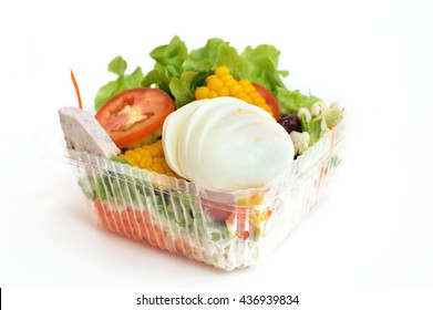 Salad In Takeaway Container On White Background