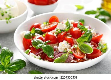 Salad with tomato, italian ricotta cheese and basil - Powered by Shutterstock